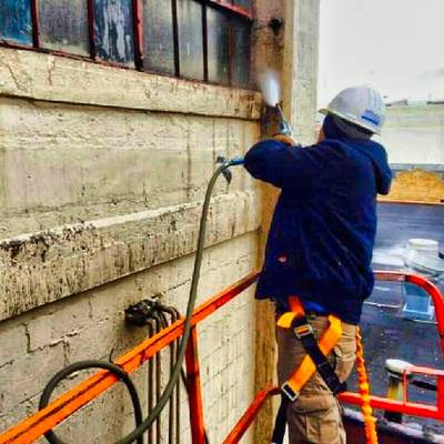 power-washing specialists removing bird droppings