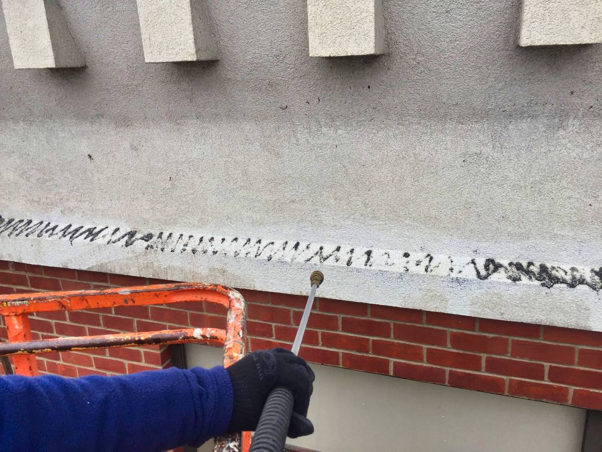 power washing of droppings of building facade