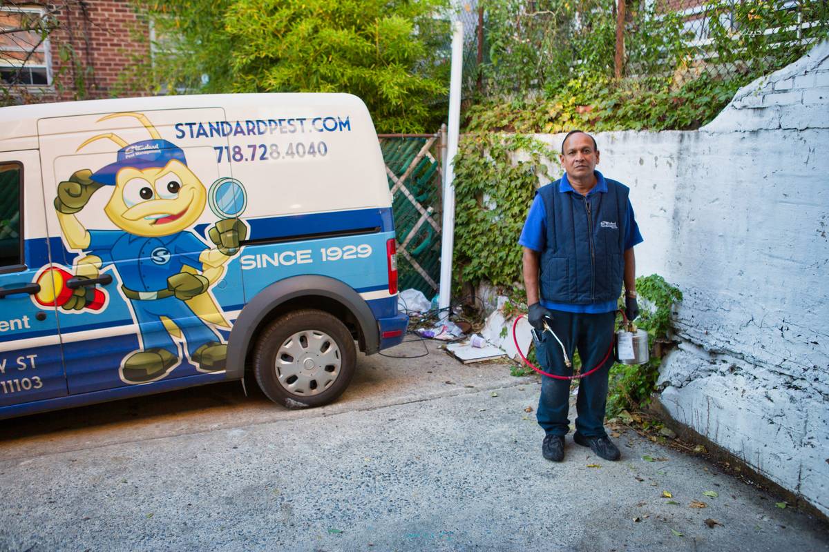 exterminator from Standard Pest management with van