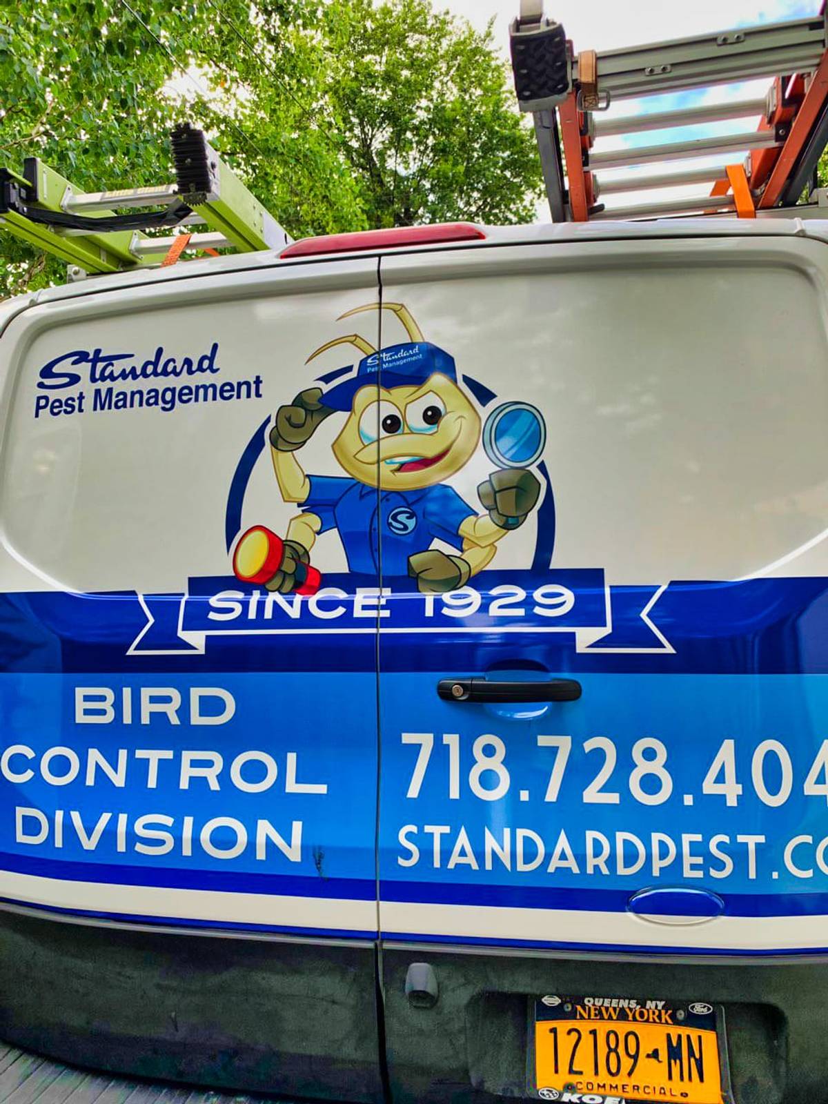 Rear view of Standard Pest Company Vehicle